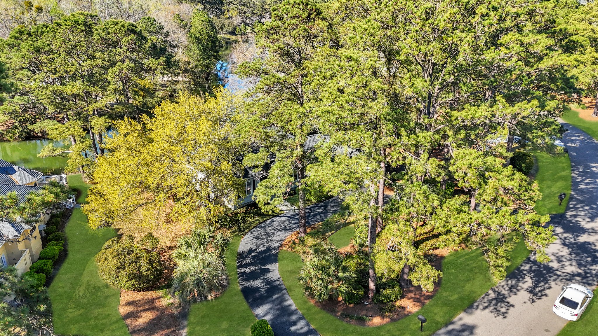 Updated Moss Creek home at 80 Peninsula Drive with lagoon views, new flooring, and navy office
