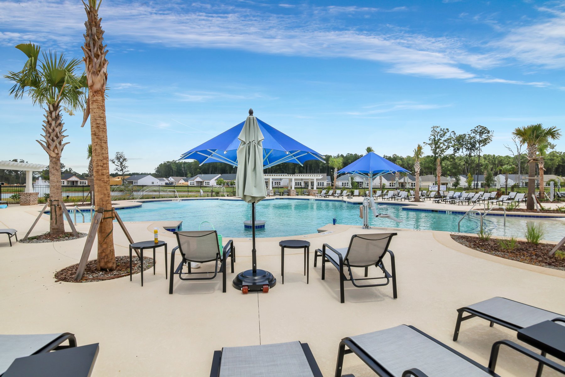 Sunset over a peaceful 55+ Bluffton community with walking trails and vibrant, active living.