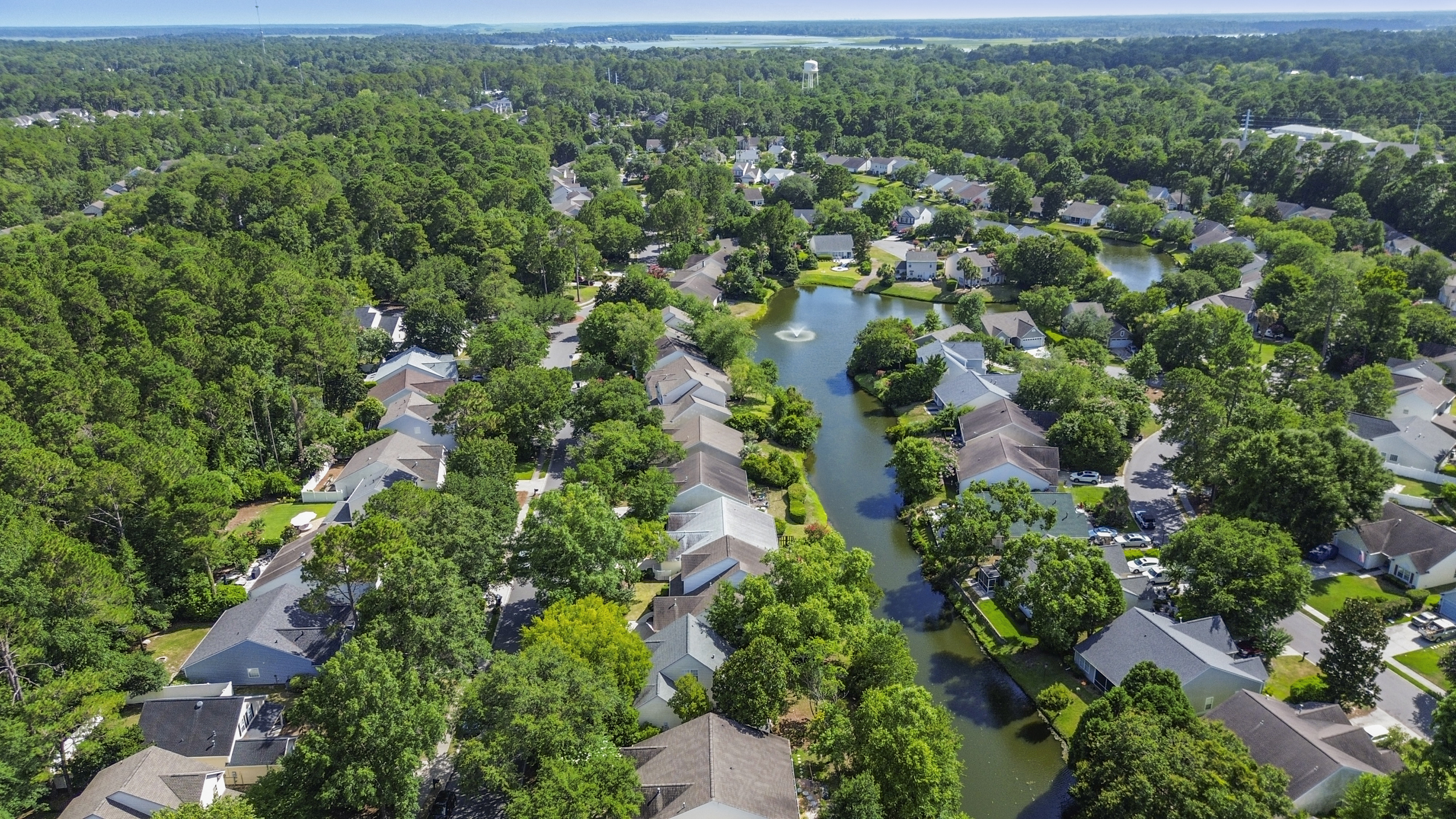 Turnkey Bluffton home with lagoon views, screened porch, and luxury kitchen in Lake Linden community.